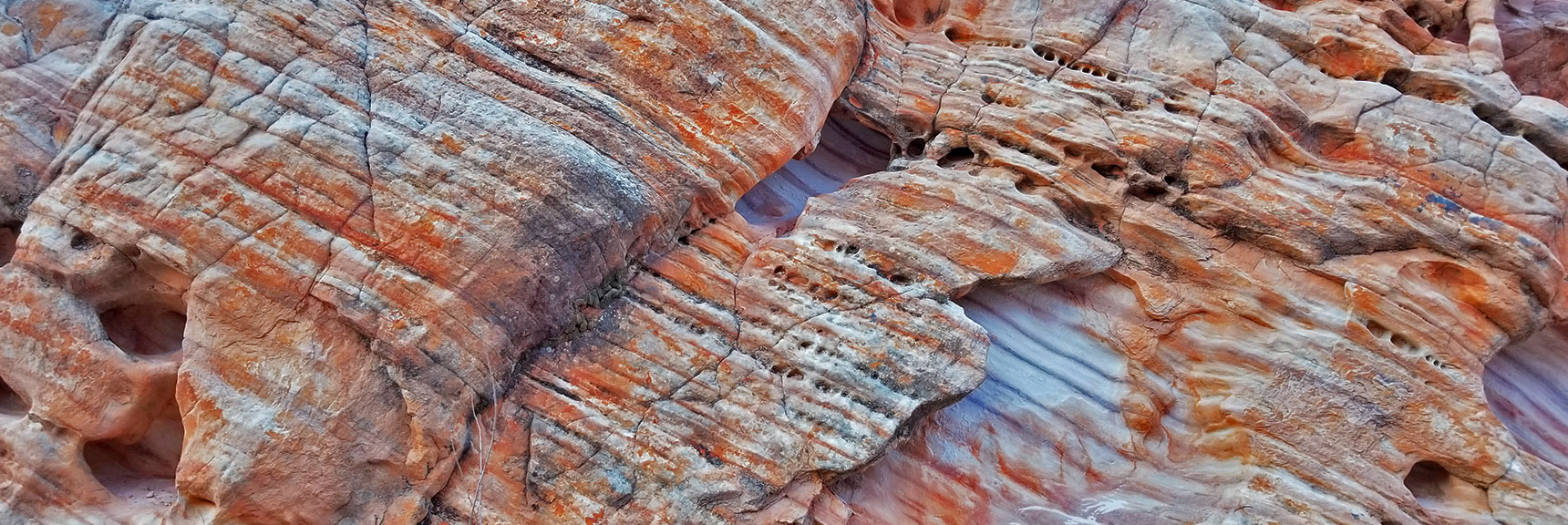 Colorful Fire Wave Rock Formations in the Northern Canyon Wash on Prospect Trail in Valley of Fire State Park, Nevada