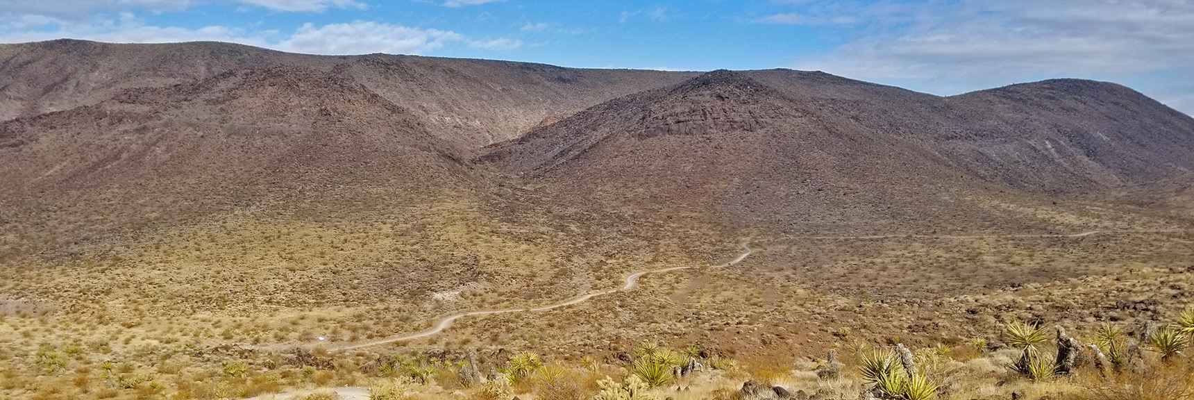 Looking Back Down the Trail Toward the Trailhead. Have Gained a Lot of Elevation! | McCullough Hills Trail in Sloan Canyon National Conservation Area, Nevada