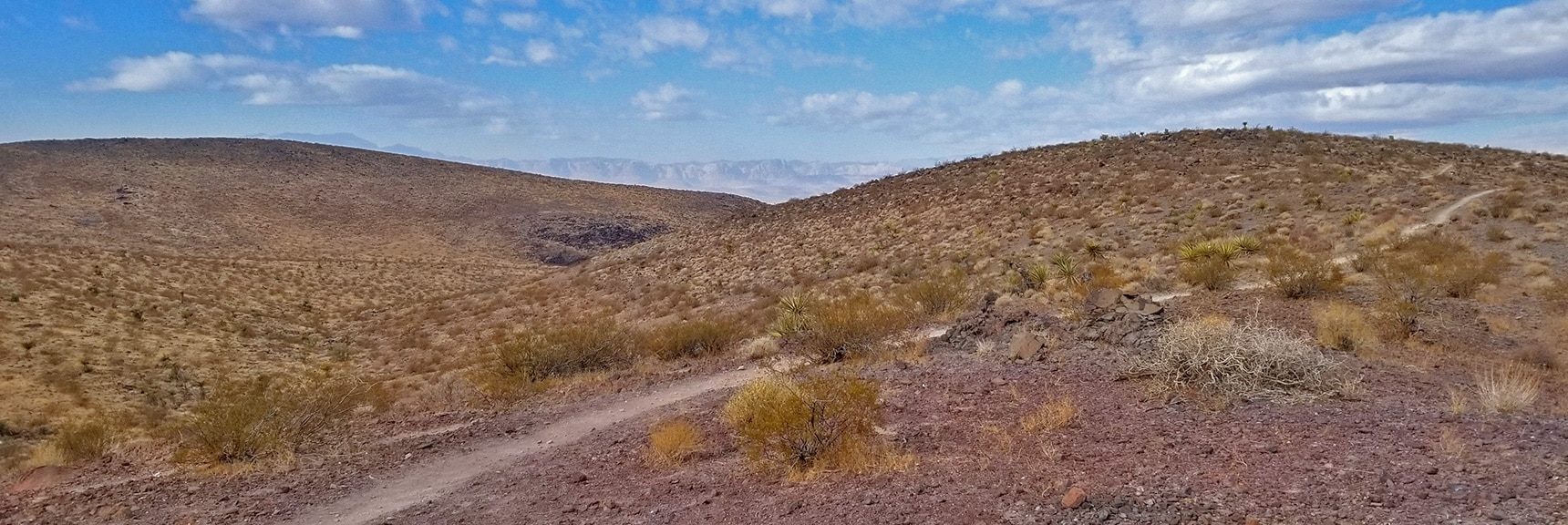 Looking Toward Anthem and Across the Las Vegas Valley to Rainbow Mountains and Red Rock Park| McCullough Hills Trail in Sloan Canyon National Conservation Area, Nevada