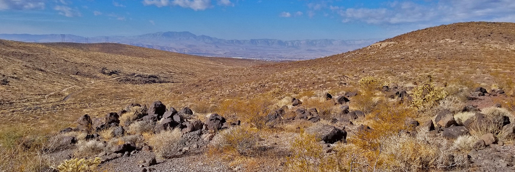 View Across Las Vegas Valley Toward Potosi Mt, Rainbow Mountains and Red Rock Park | McCullough Hills Trail in Sloan Canyon National Conservation Area, Nevada
