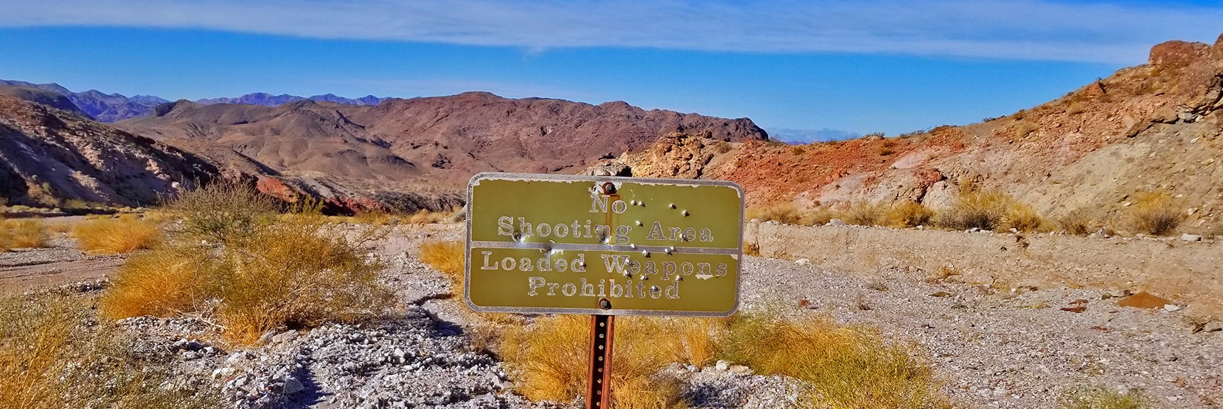 Bullet Riddled "No Shooting Allowed" Sign on Fortification Hill Rd. | Fortification Hill | Lake Mead National Recreation Area, Arizona