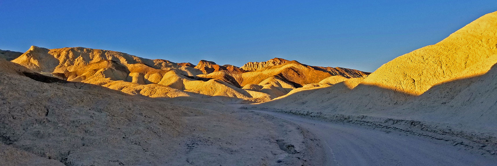 Western View Toward Colorful Hills: Golds, Reds, Browns and Greens Artistically Blend Together. | Twenty Mule Team Canyon | Death Valley National Park, California