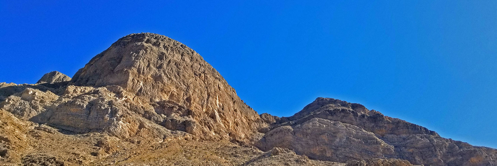 Sheer Cliffs on West Side of Mts. Possible Approach Through the Saddle Between the Two | Little La Madre Mt, Little El Padre Mt, Little Burnt Peak | Near La Madre Mountains Wilderness, Nevada