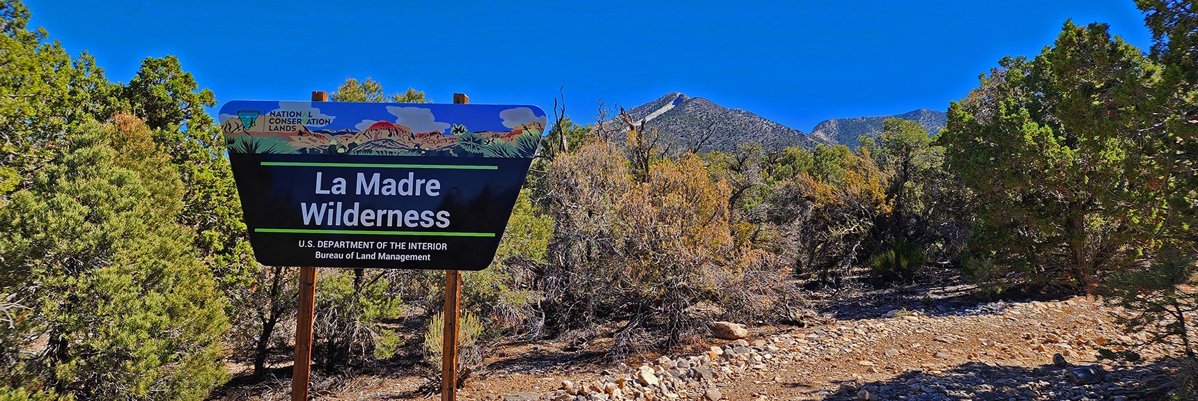 Official La Madre Mountains Wilderness Entry Sign in Campground. La Madre Mt to Right | Kyle Canyon Grand Crossing | Northern Half | La Madre Mountains Wilderness, Nevada