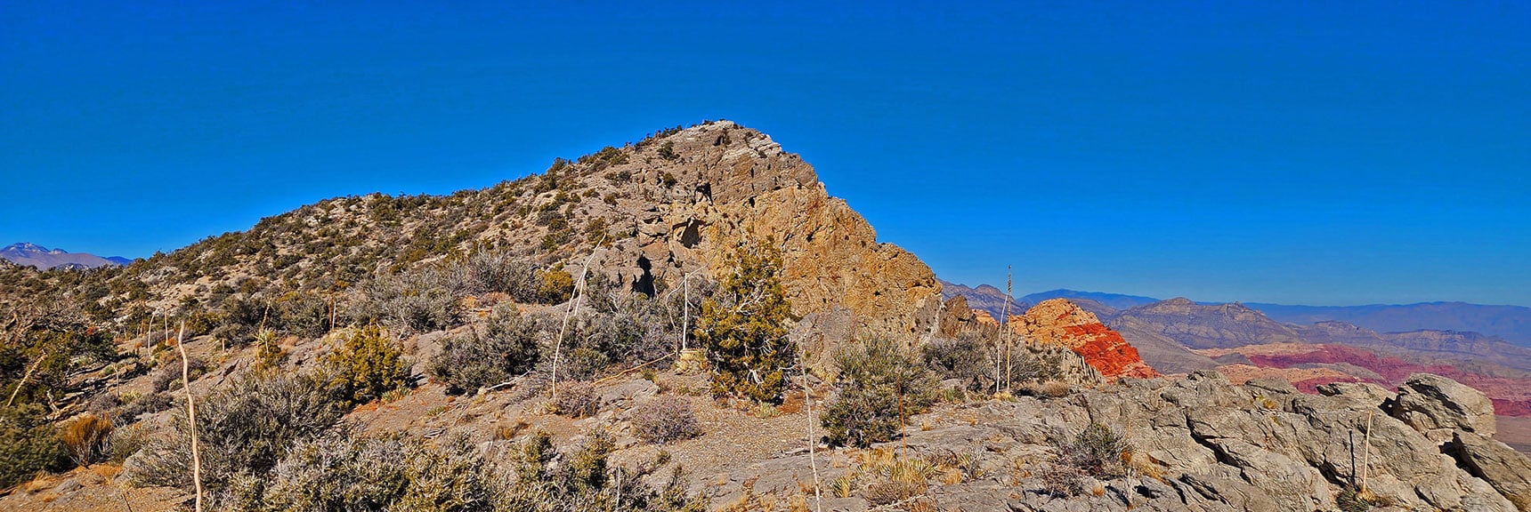 Zoom in on First Creek Overlook Cliff. Descent to Mt. Wilson Begins Just Beyond. | Rainbow Mountains Mid Upper Crest Ridgeline from Lovell Canyon, Nevada