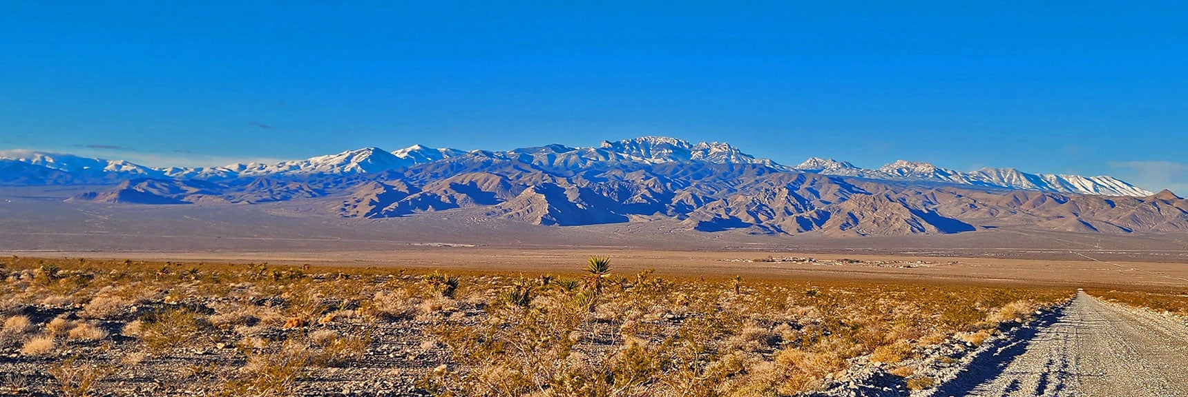 Ascending Mormon Well Road Looking Back Toward Mt. Charleston Wilderness. | Fossil Ridge Far East | Desert National Wildlife Refuge, Nevada