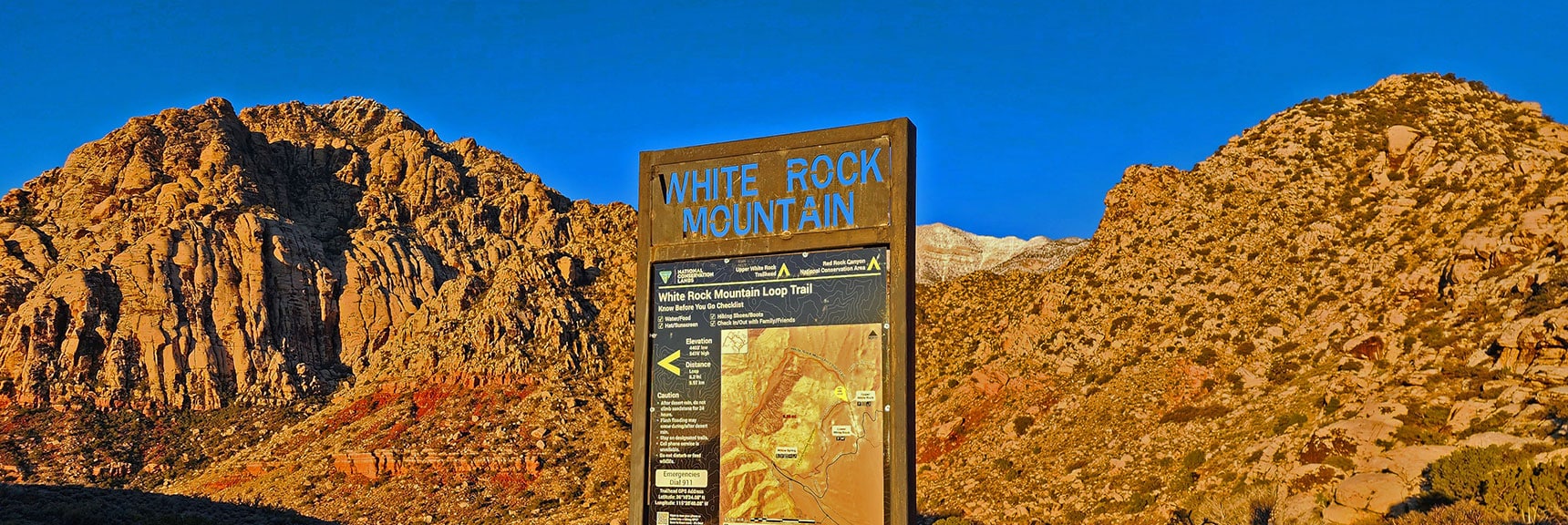 White Rock Mountain as Backdrop to Trailhead Sign | White Rock Mountain Loop Trail | Red Rock Canyon, Nevada