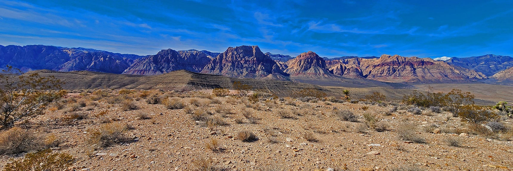 View West Toward Rainbow Mts. & Snowcapped Tip of Charleston Wilderness. | Western Trails and Ridges | Blue Diamond Hill | Red Rock Canyon, Nevada