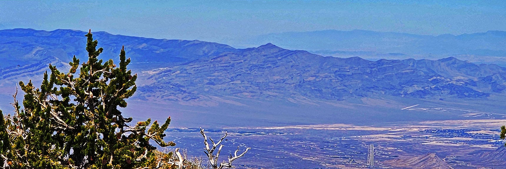 Gass Peak Above Northern Vegas Valley. Triangle-Shaped Gun Range Below. | Fletcher Canyon to Harris Mountain Summit | Mt Charleston Wilderness, Nevada