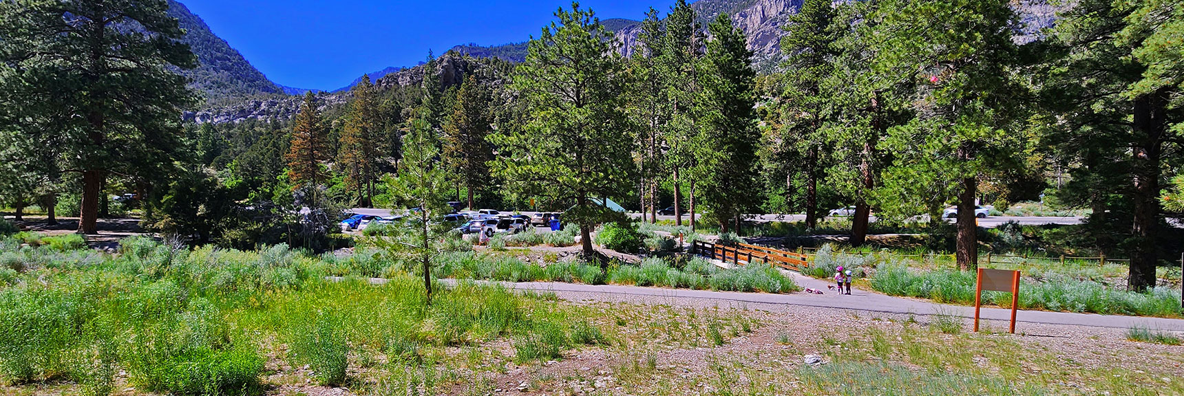 Return to Fletcher Canyon Trailhead Parking Area. Note Two Young Cyclists and Their Dog at Bridge Entrance! | Fletcher View Ridge | Mt Charleston Wilderness, Nevada