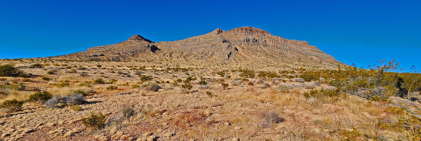 Rounding to the Bluff's South Side, Now on Powerline Maintenance Road Parallel to Hwy 160. | Landmark Bluff Circuit | Lovell Canyon, Nevada