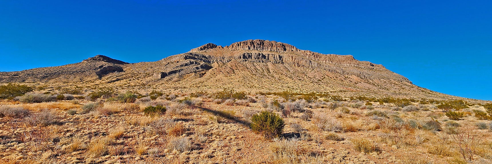 The South Side is Mostly Vertical. Summit Gully to Left Gets You to Central Cliff Base. | Landmark Bluff Circuit | Lovell Canyon, Nevada