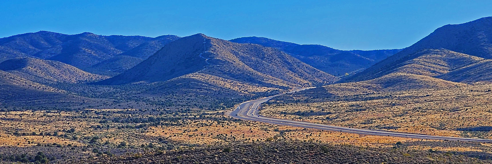 Highway 160 in View to the East as it Ascends Toward Potosi Mountain. | Landmark Bluff | Lovell Canyon, Nevada