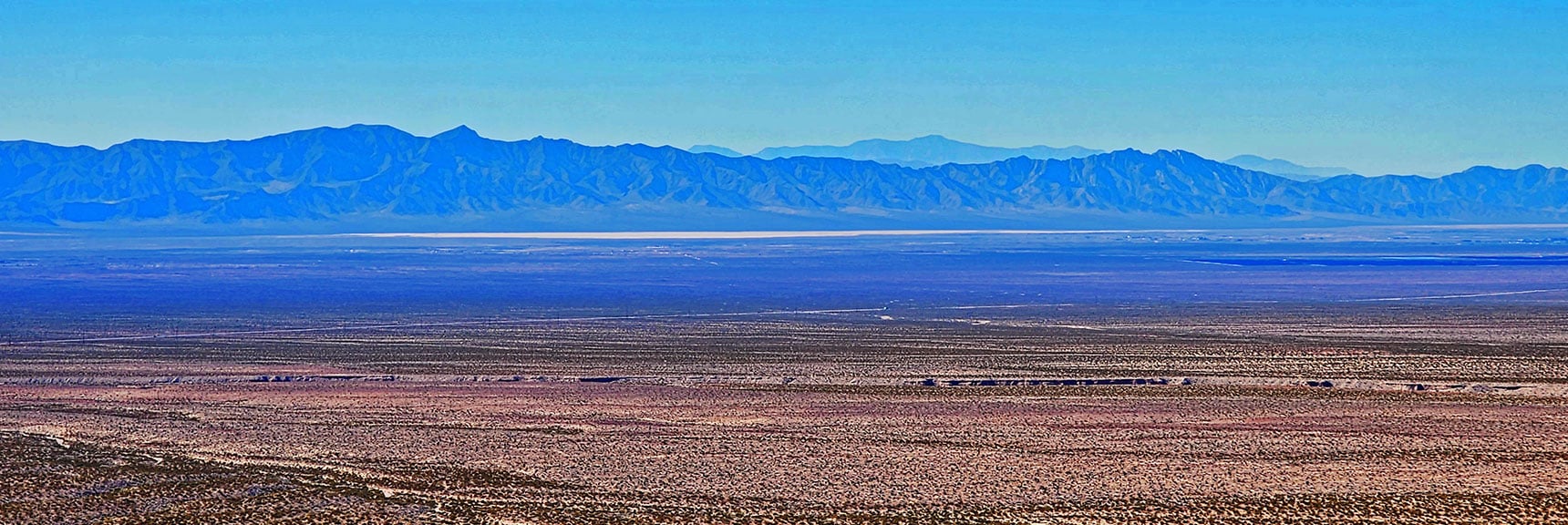 View West To Black Mts. Dim Outline of Telescope & Wildrose Peaks. | Landmark Bluff | Lovell Canyon, Nevada