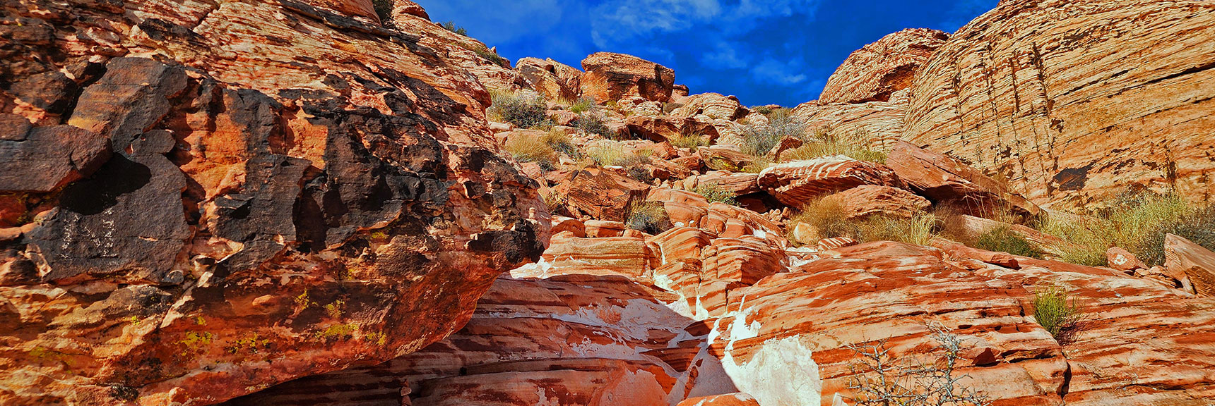 Above the Cliff Line the Incline Decreases. Weave Among Some Larger Ledges | Grand Staircase | Calico Basin, Nevada