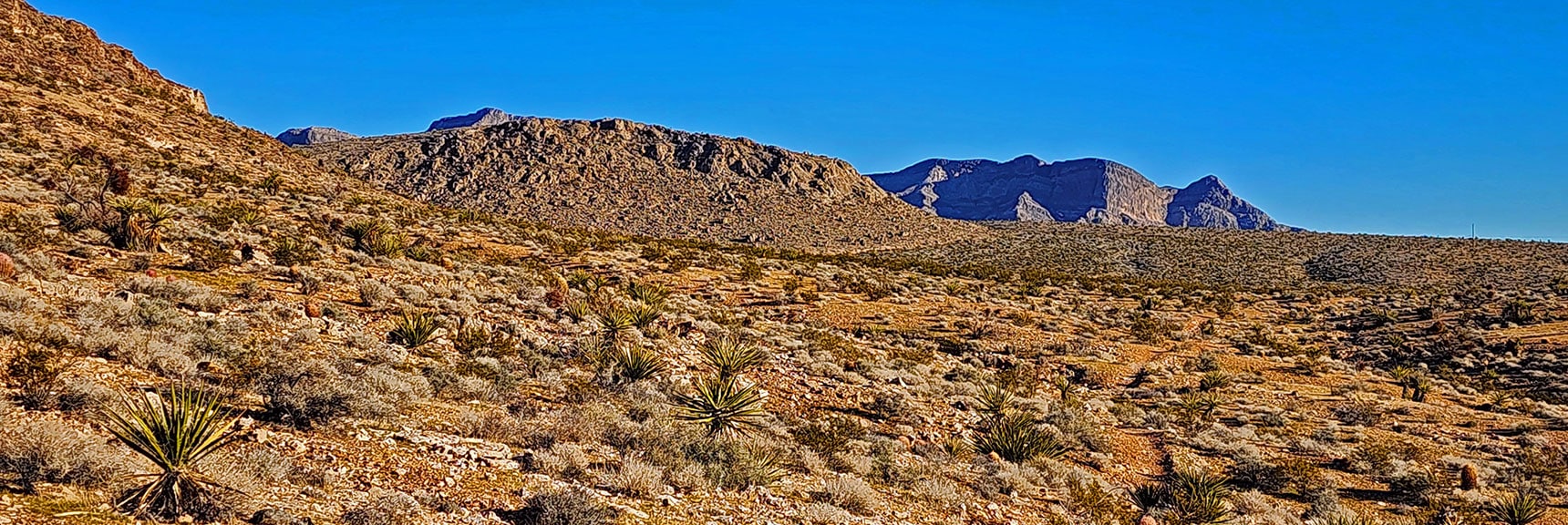 Rounding Hills Toward Brownstone Basin. Summerlin Ridge on Right | Brownstone Trail | Calico Basin | Brownstone Basin | La Madre Mountains Wilderness, Nevada