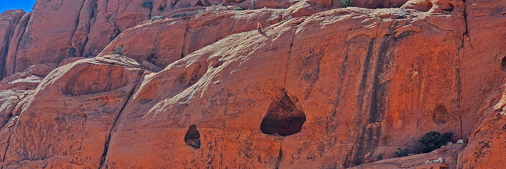 Closer View of Rock Climbers. Descending by Rope to Openings Below. | Pink Goblin Loop | Calico Basin, Nevada
