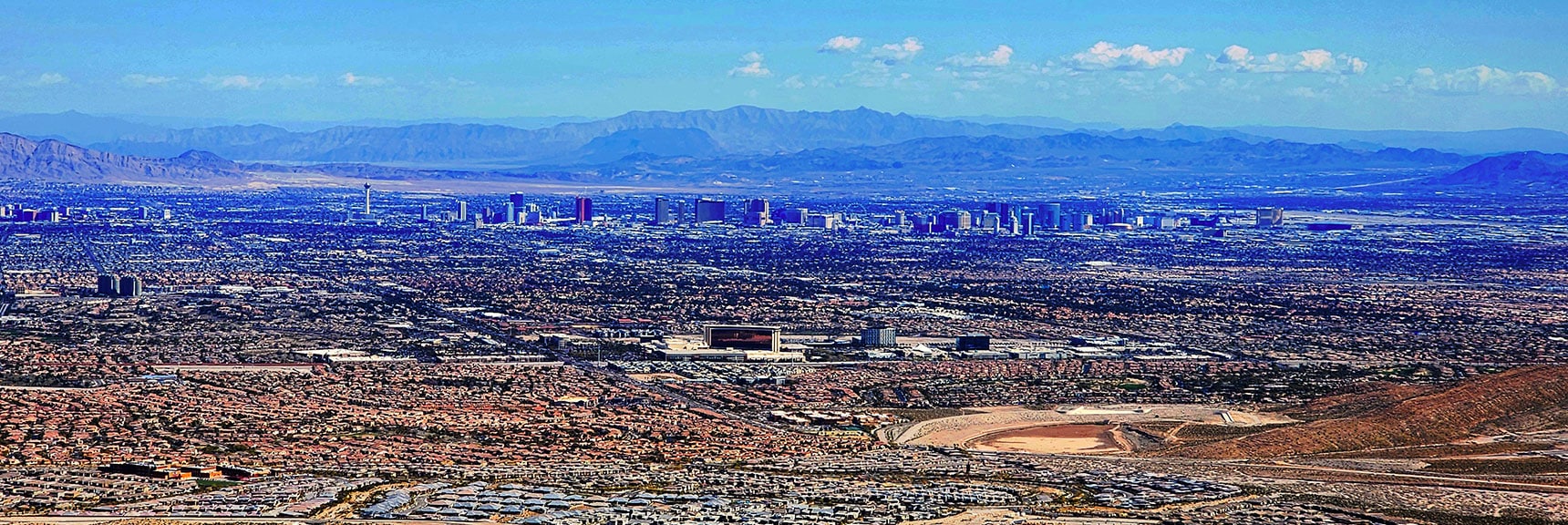 Las Vegas Strip in Light of Afternoon Sun. Red Rock Casino in Foreground. | Gray Cap Ridge Southeast Summit | La Madre Mountains Wilderness, Nevada